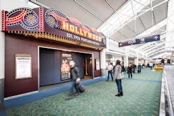 A PDX passenger stops to admire the Hollywood Theatre's marquee. A PDX passenger stops to admire the Hollywood Theatre's marquee.