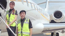 Kelly Goh and Shahridan Heng, Flight Operations, Seletar following completion of their Safety 1st online training modules.