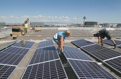 Large photovoltaic system in construction on cargo hall at Frankfurt Airport. Large photovoltaic system in construction on cargo hall at Frankfurt Airport.