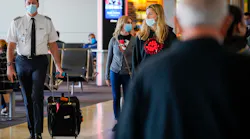 A pilot walks on the councourse at DFW International Airport on Tuesday, June 30, 2020, in Dallas.