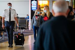 A pilot walks on the councourse at DFW International Airport on Tuesday, June 30, 2020, in Dallas. A pilot walks on the councourse at DFW International Airport on Tuesday, June 30, 2020, in Dallas.