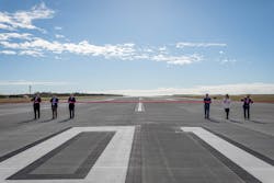 Following an official ribbon cutting on the runway, invited VIP guests gathered airside with 150 Brisbane Airport Corporation staff and 10 local plane spotters, who won a place at the event in a lucky draw, to watch the first aircraft movements and sky show. Following an official ribbon cutting on the runway, invited VIP guests gathered airside with 150 Brisbane Airport Corporation staff and 10 local plane spotters, who won a place at the event in a lucky draw, to watch the first aircraft movements and sky show.