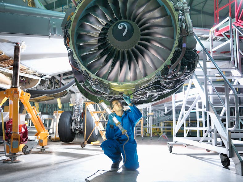 Maintenance is done on a 737 engine.
