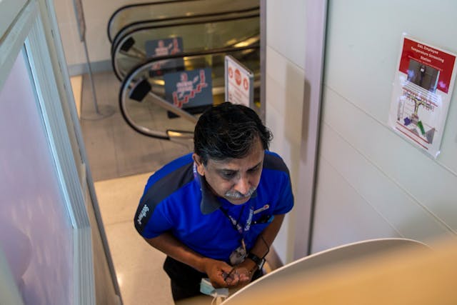 Southwest Airlines customer service supervisor Arshad Khan goes through a temperature check at a Wello temperature check kiosk at an employee screening station at Dallas Love Field.