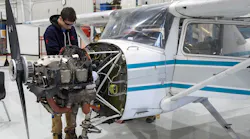 Student At Fanshawe College’s Norton Wolf School Of Aviation Technology Inspects An Aircraft