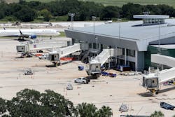 Terminals for Southwest Airlines remain mostly empty as a Delta Airlines plane taxis past the airside terminal at Tampa International Airport on Aug. 14. Terminals for Southwest Airlines remain mostly empty as a Delta Airlines plane taxis past the airside terminal at Tampa International Airport on Aug. 14.