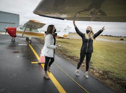 Sara Weidler, right, an instructor for InFlight Pilot Training, worked with student pilot Shea Kieren at Flying Cloud Airport. Regional airfields are seeing a big jump in interest as people have more time to focus on their goals