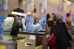 During the global coronavirus pandemic Ana Ramos, right, is being tested for covid19 in Tom Bradley international at LAX on Tuesday, Nov. 17, 2020 in Los Angeles, CA. (Francine Orr/ Los Angeles/TNS) During the global coronavirus pandemic Ana Ramos, right, is being tested for covid19 in Tom Bradley international at LAX on Tuesday, Nov. 17, 2020 in Los Angeles, CA. (Francine Orr/ Los Angeles/TNS)