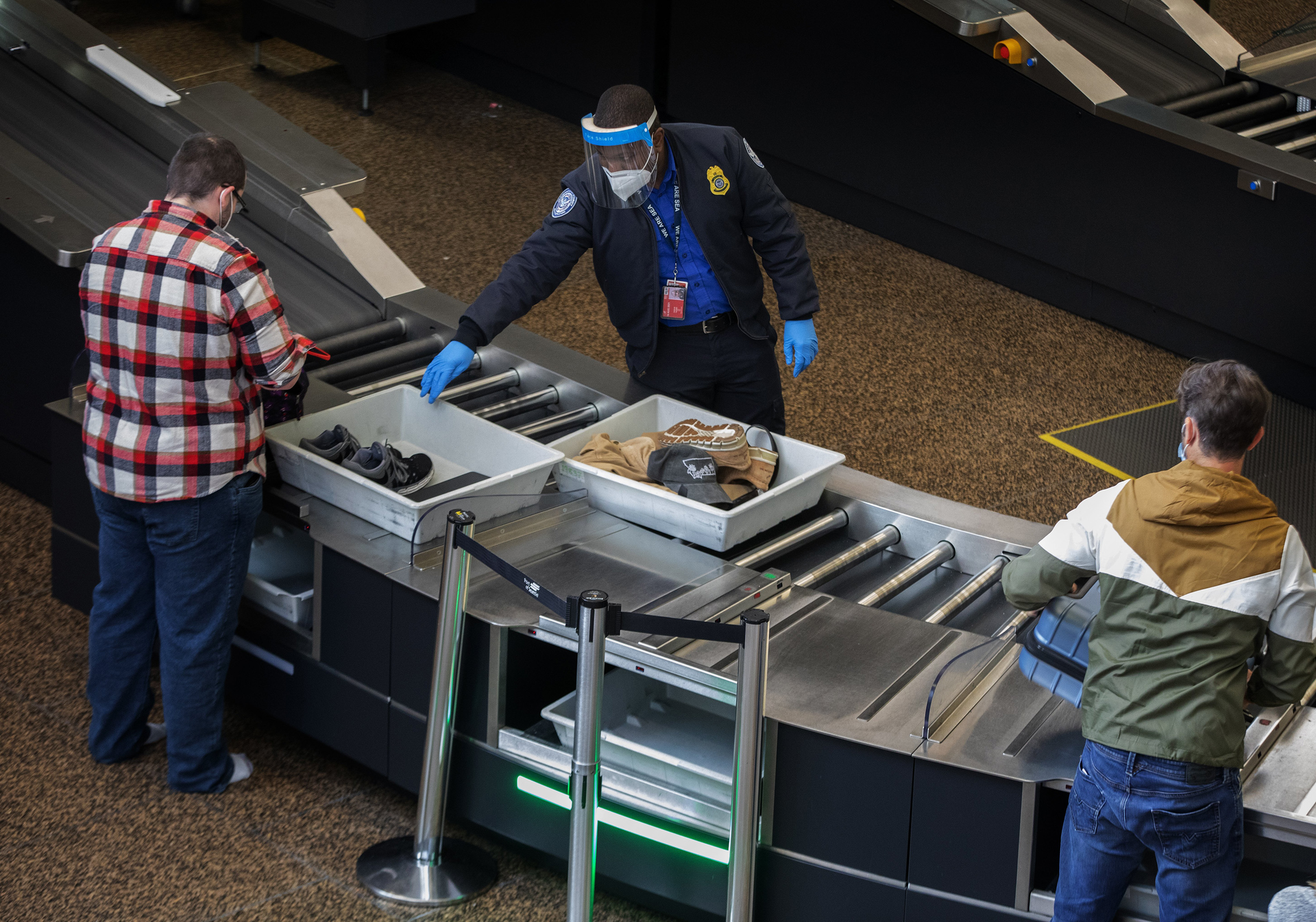 Passengers go through security at Seattle-Tacoma International Airport in SeaTac Thursday, Sept. 24, 2020. A controversial U.S. program to monitor 'high-risk' passengers at airports and on domestic flights has been poorly managed, with some fliers continuing to be monitored after they were not longer considered a risk, a government audit found. (Ellen M. Banner/Seattle Times/TNS)