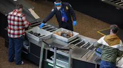 Passengers go through security at Seattle-Tacoma International Airport in SeaTac Thursday, Sept. 24, 2020. A controversial U.S. program to monitor 'high-risk' passengers at airports and on domestic flights has been poorly managed, with some fliers continuing to be monitored after they were not longer considered a risk, a government audit found. (Ellen M. Banner/Seattle Times/TNS)