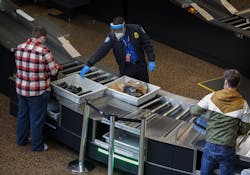 Passengers go through security at Seattle-Tacoma International Airport in SeaTac Thursday, Sept. 24, 2020. A controversial U.S. program to monitor 'high-risk' passengers at airports and on domestic flights has been poorly managed, with some fliers continuing to be monitored after they were not longer considered a risk, a government audit found. (Ellen M. Banner/Seattle Times/TNS) Passengers go through security at Seattle-Tacoma International Airport in SeaTac Thursday, Sept. 24, 2020. A controversial U.S. program to monitor 'high-risk' passengers at airports and on domestic flights has been poorly managed, with some fliers continuing to be monitored after they were not longer considered a risk, a government audit found. (Ellen M. Banner/Seattle Times/TNS)