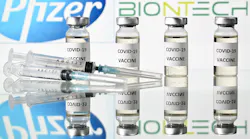 An illustration picture shows vials with Covid-19 Vaccine stickers attached and syringes with the logo of US pharmaceutical company Pfizer and German partner BioNTech, on November 17, 2020.