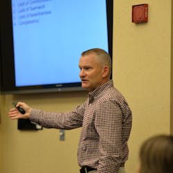 Keith Clark, quality control and technical support rep, Phillips 66 Aviation, lectures during a training session.