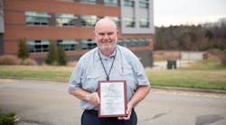 Program Director for the Aviation Electronics Technology Program at Guilford Technical Community College, Larry Belton, with the Charles Taylor Master Mechanic Award. Program Director for the Aviation Electronics Technology Program at Guilford Technical Community College, Larry Belton, with the Charles Taylor Master Mechanic Award.
