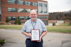 Program Director for the Aviation Electronics Technology Program at Guilford Technical Community College, Larry Belton, with the Charles Taylor Master Mechanic Award. Program Director for the Aviation Electronics Technology Program at Guilford Technical Community College, Larry Belton, with the Charles Taylor Master Mechanic Award.