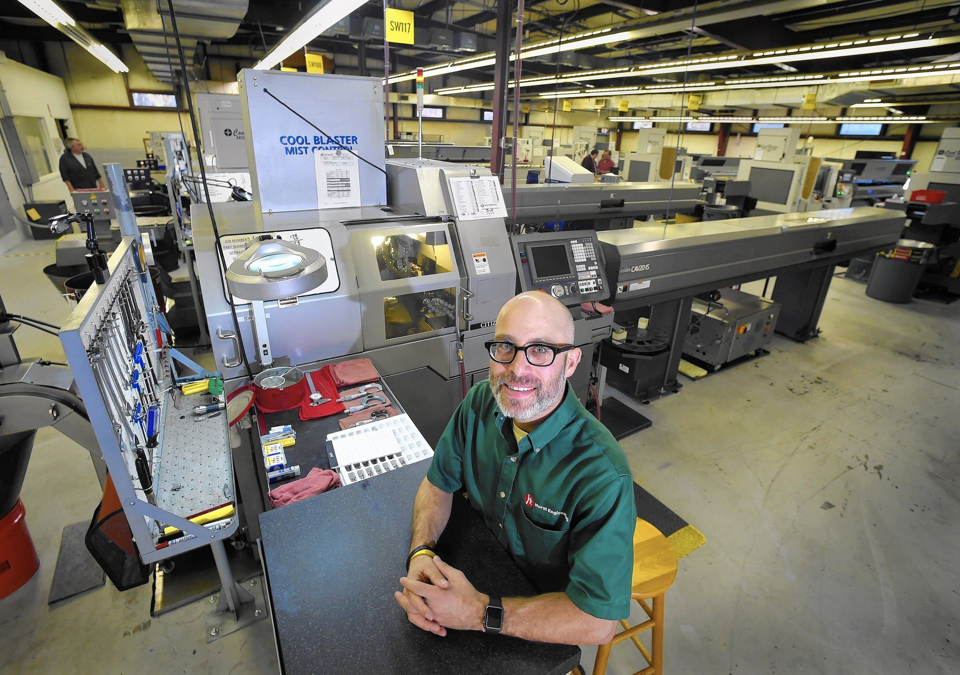 Scott LIvingston, president and CEO of Horst Engineering, South Windsor, inside the company's new shop that contains 18 CNC Swiss Screw Machines. Horst produces precision metal aerospace components. The company opened a plant in Mexico in 2006 and this year closed it and expanded in this South Windsor plant.