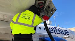 A PrimeFlight employee sporting a high visibility jacket. A PrimeFlight employee sporting a high visibility jacket.