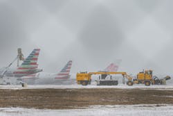 An American Airlines jets get inline to be de-iced at DFW International Airport before takeoff as winter flurries arrive in Irving on Sunday, February 14, 2021 ahead of major snowstorm. An American Airlines jets get inline to be de-iced at DFW International Airport before takeoff as winter flurries arrive in Irving on Sunday, February 14, 2021 ahead of major snowstorm.