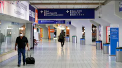 People make their way through terminal C at DFW International Airport on Wednesday, April 8, 2020.