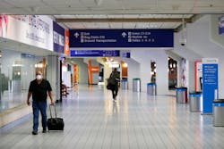 People make their way through terminal C at DFW International Airport on Wednesday, April 8, 2020. People make their way through terminal C at DFW International Airport on Wednesday, April 8, 2020.