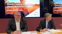 On the left Mr Shaun Roper, Managing Director Airports, Vanderlande, and on the right Mr Simon Hickey, CEO WSA