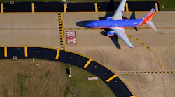 A Southwest Airlines 737-7H4 holds short of the 13L-31R runway at Dallas Love Field.