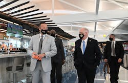 Maryland Gov. Larry Hogan and Transportation Secretary Greg Slater, left, tour the new Concourse A Extension project, which includes five new gates and new food options.