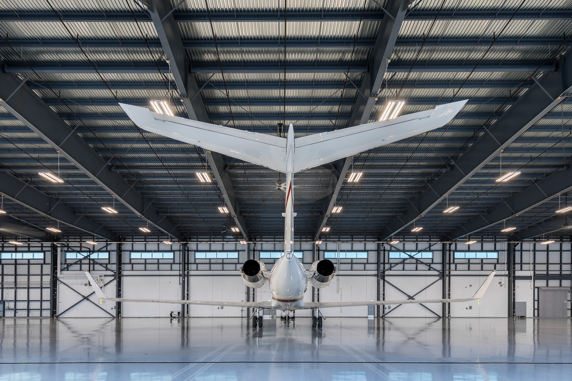 The hangars are pre-engineered metal with an upgraded skin consisting of a 3-inch insulated panel instead of the typical corrugated panel.