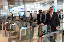 LA Mayor Eric Garcetti going through the new automated biometric boarding gates at LAX during the West Gates inauguration on May 24.