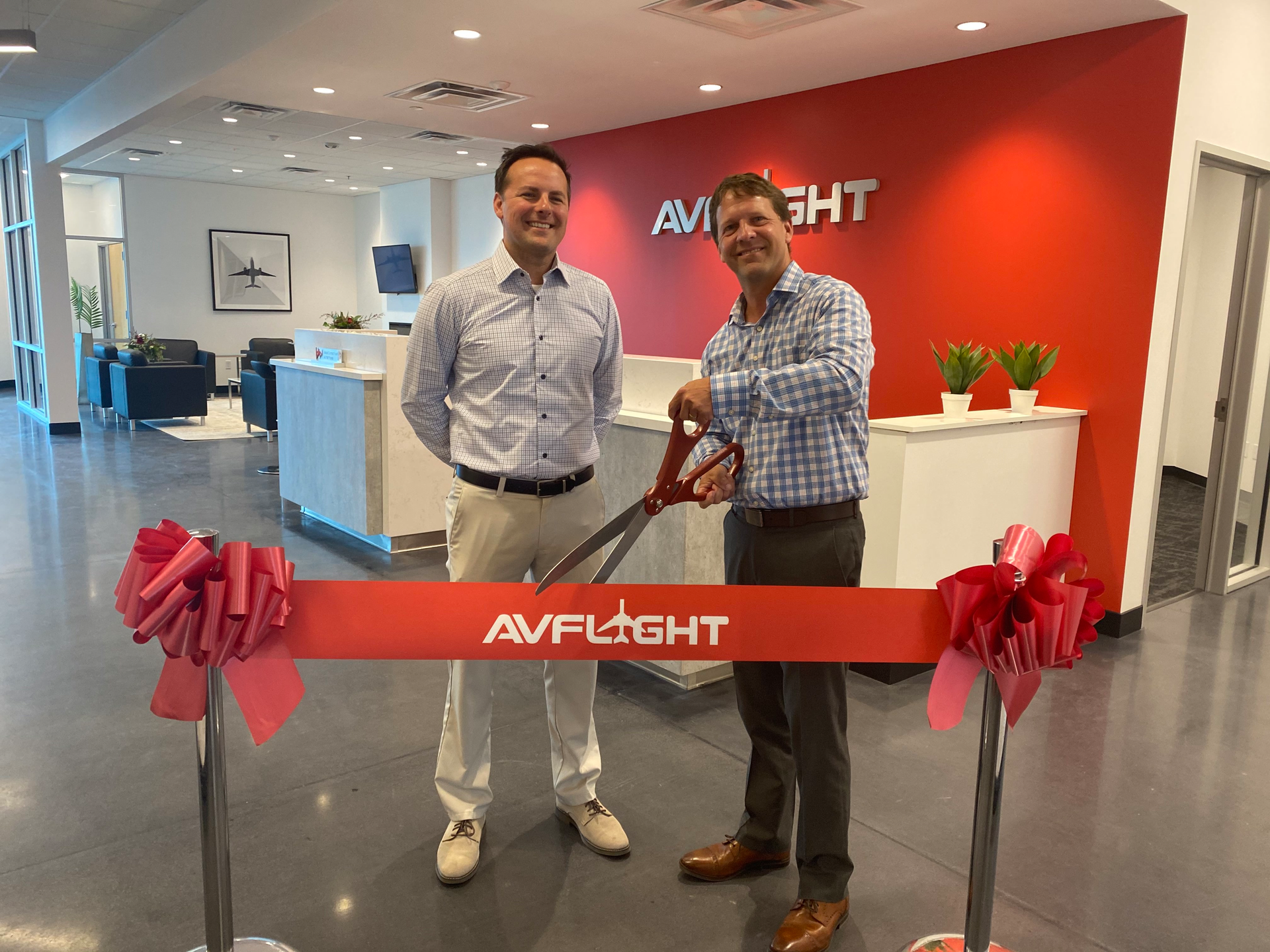 Avflight Mesa Ribbon Cutting (left To Right) Joe Meszaros, Avflight Vice President Of Operations, And Garrett Hain, Avflight Vice President Of Finance