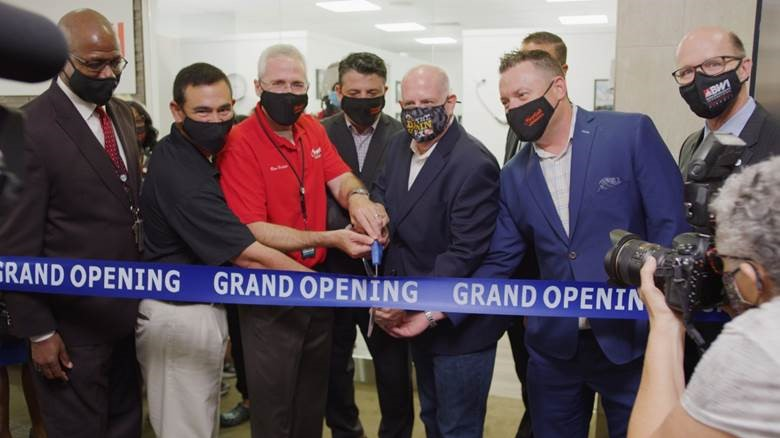 Airport executives, officials and guests welcomed FirstCall Medical Center to BWI Thurgood Marshall Airport at an open house reception on Aug. 24. FirstCall Medical Director Dr. Ron Elfenbein (red shirt) cut the ribbon joined by Gov. Larry Hogan and state officials, BWI Executive Director Ricky Smith (left end of ribbon) and Fraport USA CEO Michael Mullaney (right end of ribbon).