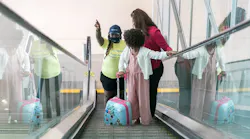 A SkySquad Team member offers assistance to travelers.