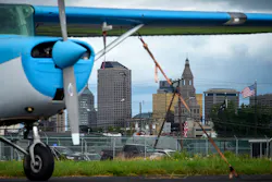 With the Hartford skyline in the background, a secured plane rests on the tarmac at Brainard airport. With the Hartford skyline in the background, a secured plane rests on the tarmac at Brainard airport.