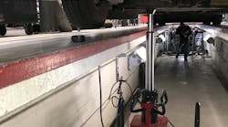 Vehicle lifting with the floor pit jack is done by an air-driven, fully hydraulic pump actuated by tandem foot pedals.