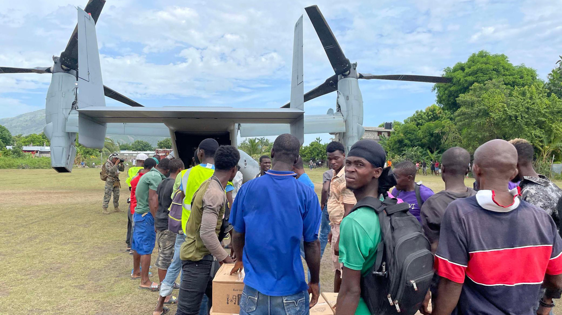 A U.S. military aircraft drops off aid on Friday, August 21, 2021 to Les Anglais, a remote community on Haiti's southern peninsula that was devastated by the August 14, 2021 earthquake.