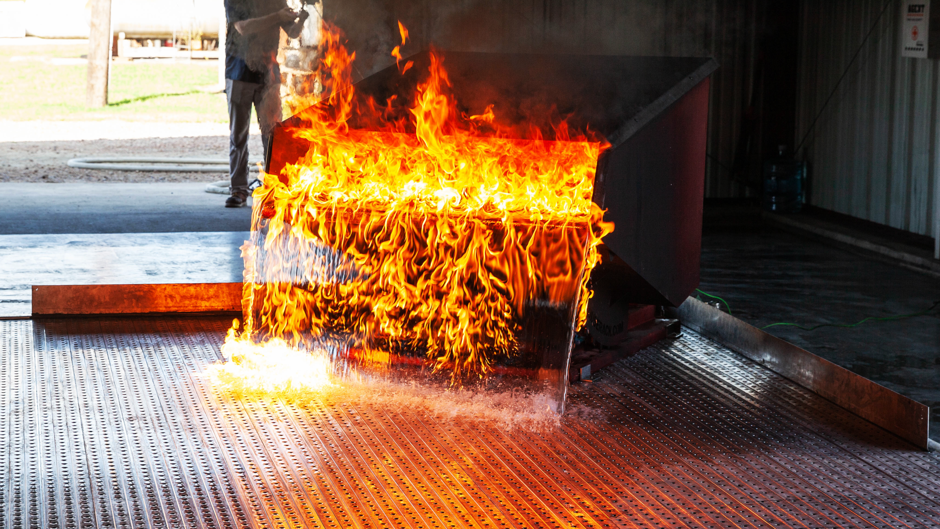 This image shows a fire test on Safespill&rsquo;s flooring system simulating a dropped wing tank.