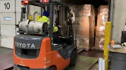 The National Air Cargo group has partnered with 'Food For The Poor' to ship surgical gowns to hospitals in Jamaica and Haiti.