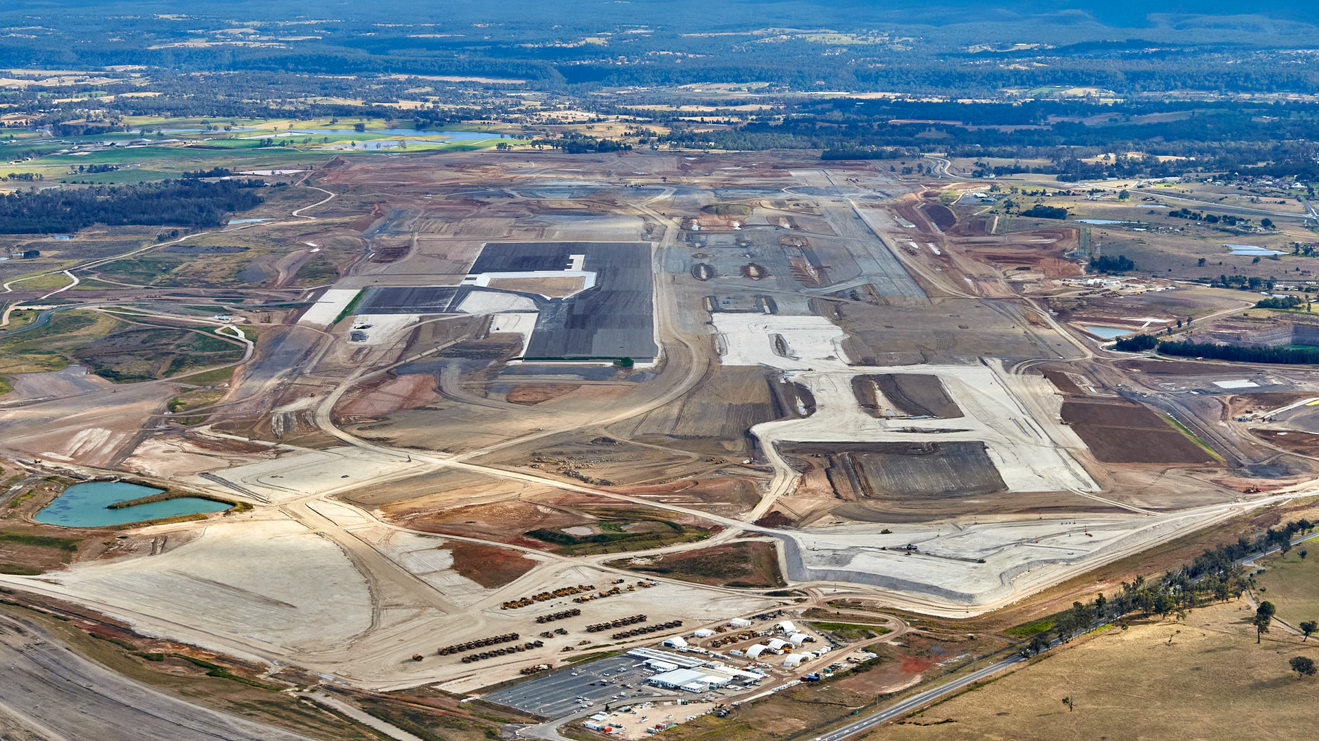 The construction of Sydney&rsquo;s new airport is directly injecting more than $100 million into businesses in Western Sydney, as new vision shows the incredible transformation of the site since earthworks began.