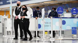 United Airlines employees stand in Terminal 1 at O'Hare International Airport, Oct. 1, 2020 in Chicago.