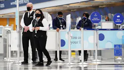 United Airlines employees stand in Terminal 1 at O'Hare International Airport, Oct. 1, 2020 in Chicago.