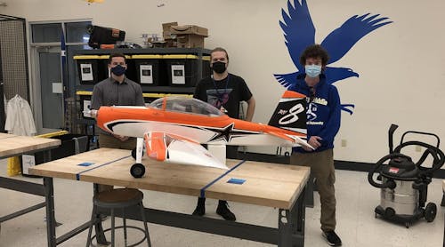 Embry-Riddle undergraduate students Joseph Ayd and Todd Martin assist master&rsquo;s student Robert Moore in the project.