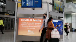 A COVID-19 testing facility is advertised at Newark Liberty International Airport on Tuesday, Nov. 30, 2021 in Newark, New Jersey. The United States, and a growing list of other countries, has restricted flights from southern African countries due to the detection of the COVID-19 Omicron variant last week in South Africa. Stocks in the travel and airline industry have fallen in recent days as fears grow over the spread and severity of the variant.