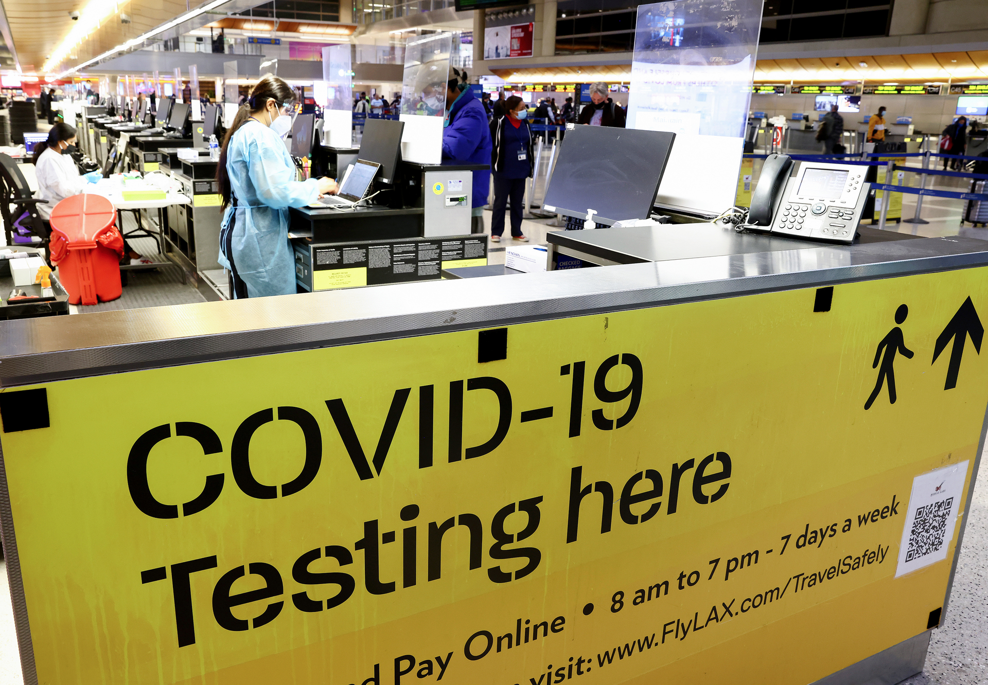 A COVID-19 test center operates inside the Tom Bradley International Terminal at Los Angeles International Airport on Dec. 1, 2021, in Los Angeles. The CDC now has started distributing free COVID-19 home test kits to international travelers arriving at airports in America.
