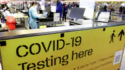 A COVID-19 test center operates inside the Tom Bradley International Terminal at Los Angeles International Airport on Dec. 1, 2021, in Los Angeles. The CDC now has started distributing free COVID-19 home test kits to international travelers arriving at airports in America.