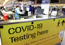 A COVID-19 test center operates inside the Tom Bradley International Terminal at Los Angeles International Airport on Dec. 1, 2021, in Los Angeles. The CDC now has started distributing free COVID-19 home test kits to international travelers arriving at airports in America. A COVID-19 test center operates inside the Tom Bradley International Terminal at Los Angeles International Airport on Dec. 1, 2021, in Los Angeles. The CDC now has started distributing free COVID-19 home test kits to international travelers arriving at airports in America.