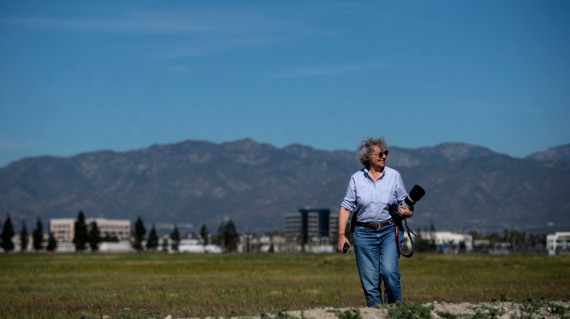 Carol Coy, Pomona Valley Audubon Society&rsquo;s burrowing owl conservation committee member, surveys the land near Ontario Airport where burrowing owls nest on Wednesday, Feb. 26, 2020. A land lease was approved on Dec. 23, 2021, for nearly 200 acres of empty land east of the airport that have been the site of the burrowing owls and their nests.