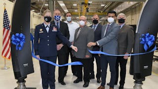Brig. Gen. Jennifer Hammerstedt, Warner Robins Air Logistics Complex commander, stands with members of the Dowty Propellers team as they open the facility for operation at Robins Air Force Base, Georgia, Dec. 16, 2021. The facility is the result of a partnership between the US Air Force and Dowty Propellers.