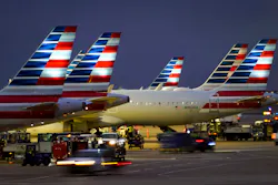 American Airlines planes are seen at the gates of Terminal C at DFW on Friday, Jan. 7, 2022.