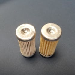 On the left is Gammon&apos;s filter, with part number GTP-2233 etched into the end. The other is a not-equal, but similar-looking filter, made for a different hydraulic application. The authentic part on the left has more pleats. In addition, the seal material of the part on the right is not compatible with all aviation fuels and the size of the seal is too large to properly seal in Gammon&apos;s gauge.