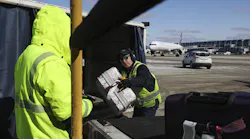 United Airlines ramp workers load baggage onto a plane at O'Hare International Airport in Chicago on Feb. 23, 2022.